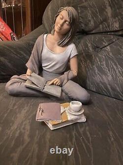 Elisa figurines woman with books sat crossed legged edition number 895