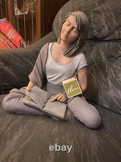 Elisa figurines woman with books sat crossed legged edition number 895